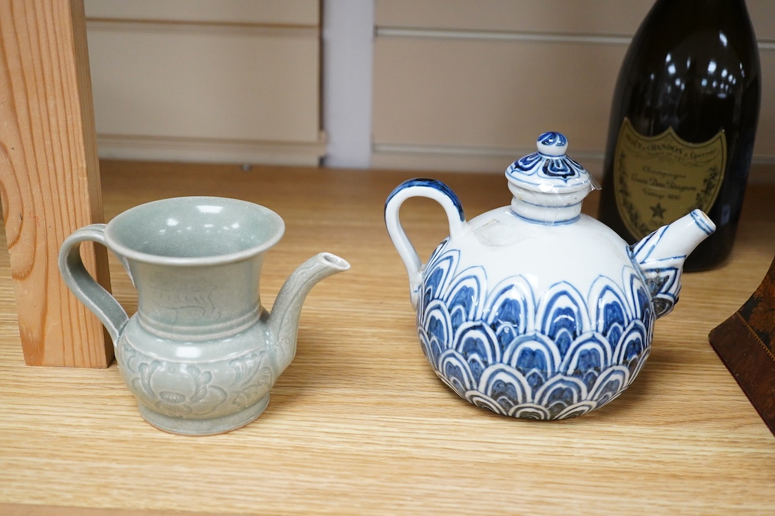 A Chinese blue and white teapot and cover, Xuande mark but later and a Chinese celadon glazed jug, tallest 13.5cm